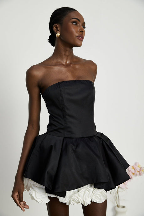 Black strapless mini dress with corset style and floral petal details named Lucie