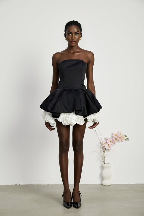 Black strapless mini dress with corset style and petal details named Lucie