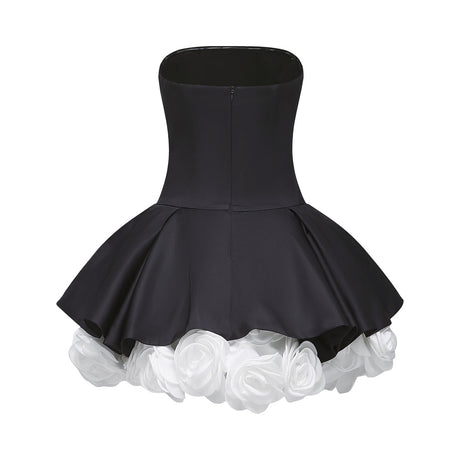 Black strapless mini dress with corset style bodice and floral petal details named Lucie
