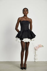 Black strapless mini dress with floral petal design and corset style bodice called Lucie