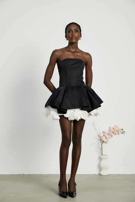 Black strapless mini dress with floral petal design and corset style bodice called Lucie
