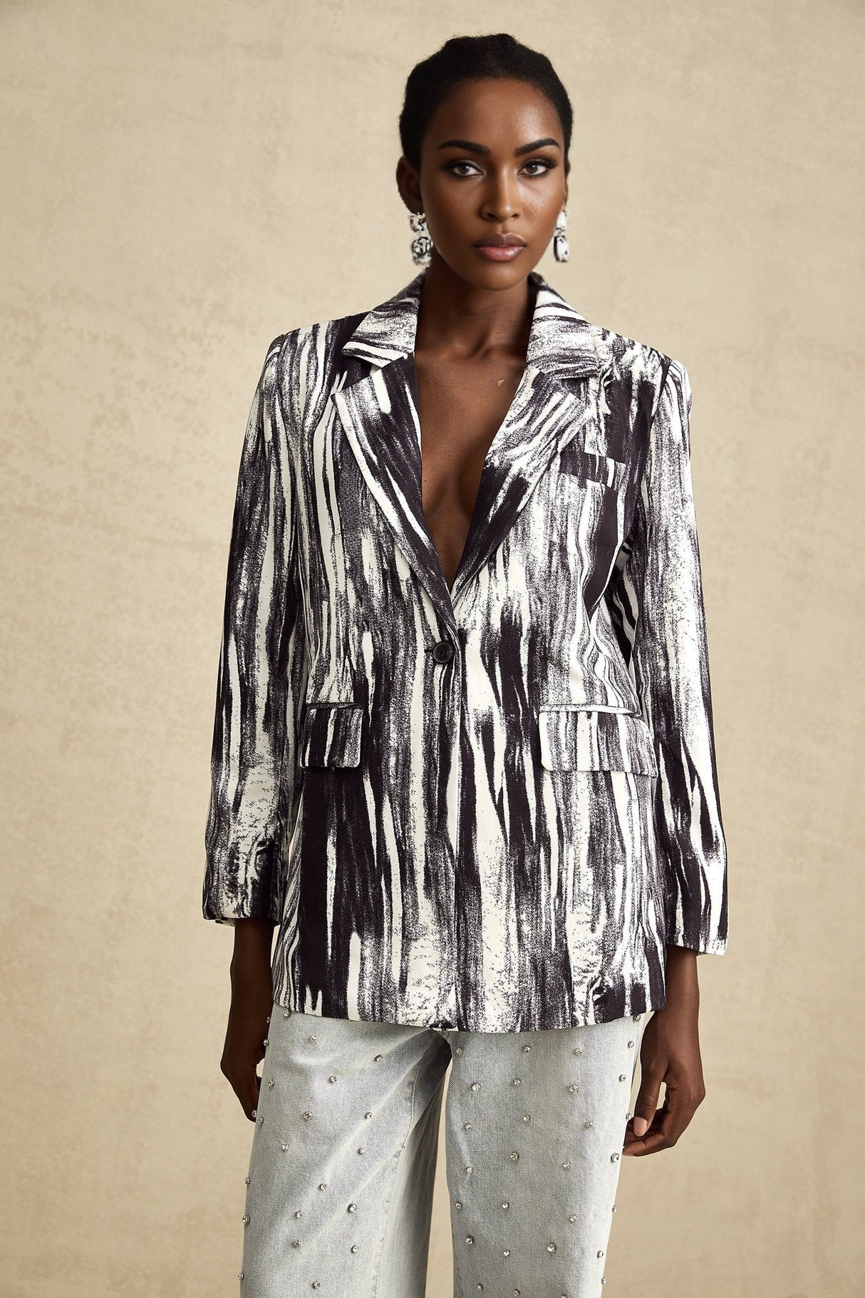 Black textured jacket with graffiti print design called Elise