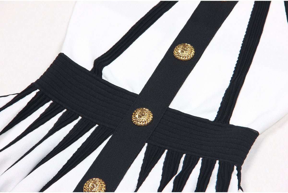Black and white A-line dress with gold accents and rose embellishment