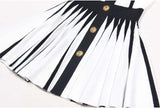 Black and white halter neck A-line dress with gold accents and rose embellishment