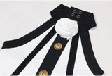 Black and white halter neck A-line dress with gold accents