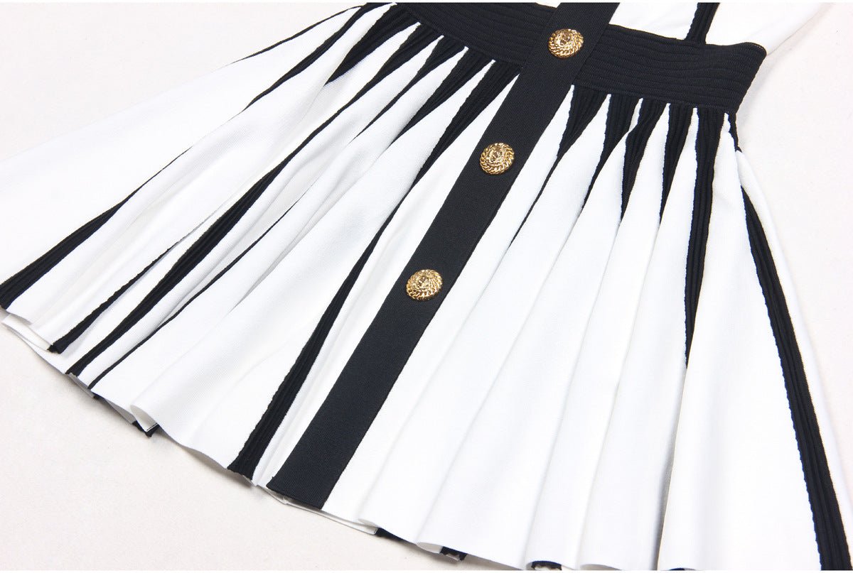 Black and white halter neck dress with gold accents and rose embellishment