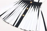 Black and white halter neck dress with gold accents and rose embellishment