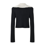 Sophia black ribbed knitted jacket with white accents and gold buttons paired with a matching bodycon skirt