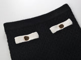 Sophia black ribbed knitted jacket with white accents and gold buttons paired with a matching bodycon skirt