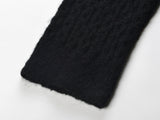 Sophia black ribbed knitted jacket with white accents and gold buttons paired with a matching bodycon skirt