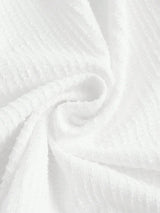 This elegant white dress features a soft, textured fabric that drapes beautifully for a flattering fit. Perfect for warm.