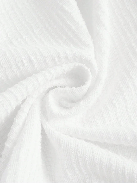 This elegant white dress features a soft, textured fabric that drapes beautifully for a flattering fit. Perfect for warm.