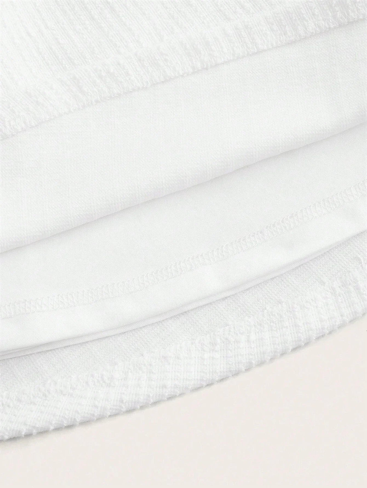 This elegant white dress features a soft, breathable fabric with a subtle texture that provides a luxurious feel. Its fitted.