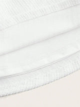 This elegant white dress features a soft, breathable fabric with a subtle texture that provides a luxurious feel. Its fitted.