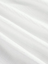 This elegant white dress features a flowing, lightweight fabric that drapes beautifully, enhancing its graceful silhouette..