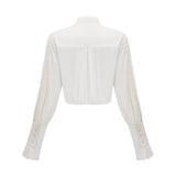 Céleste white pleated scarfcollar shirt