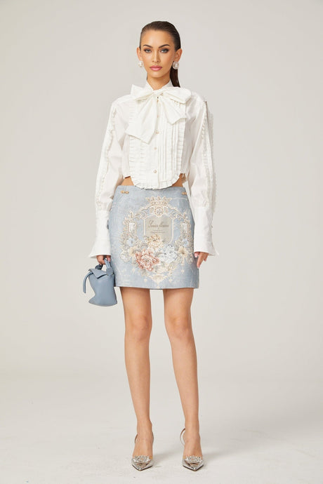 Céleste white pleated scarfcollar shirt