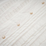 Céleste white pleated scarfcollar shirt