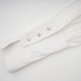 Céleste white pleated scarfcollar shirt