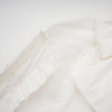 Céleste white pleated scarfcollar shirt