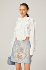 Céleste white pleated scarfcollar shirt