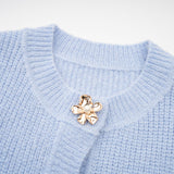 Chantal blue knit blouse and skirt matching set displayed together on a plain background