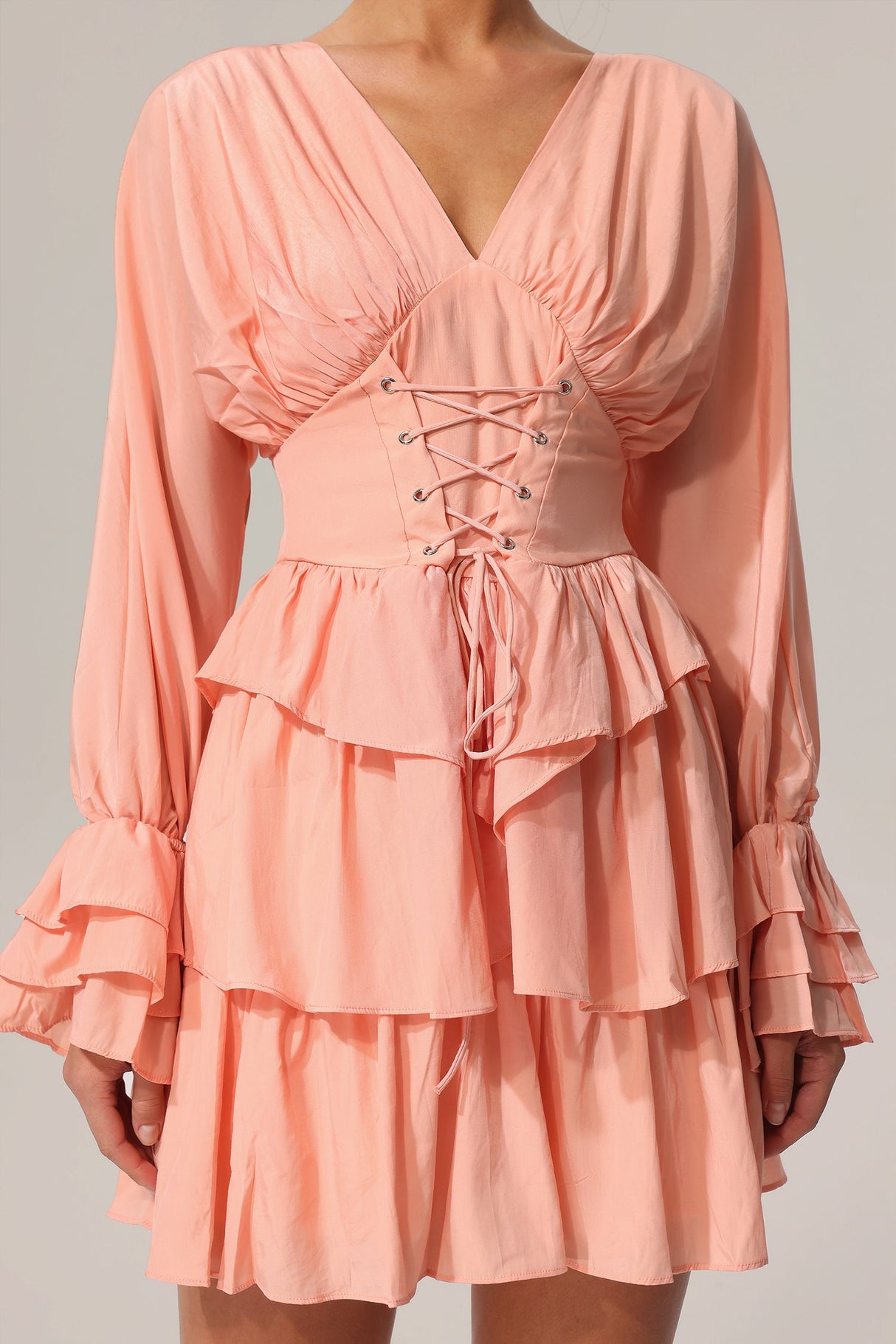 Charlotte Peach Flowing Silhouette V-Neck Dress Lightweight Material Layered Folds Flared Sleeves Cinched Waist