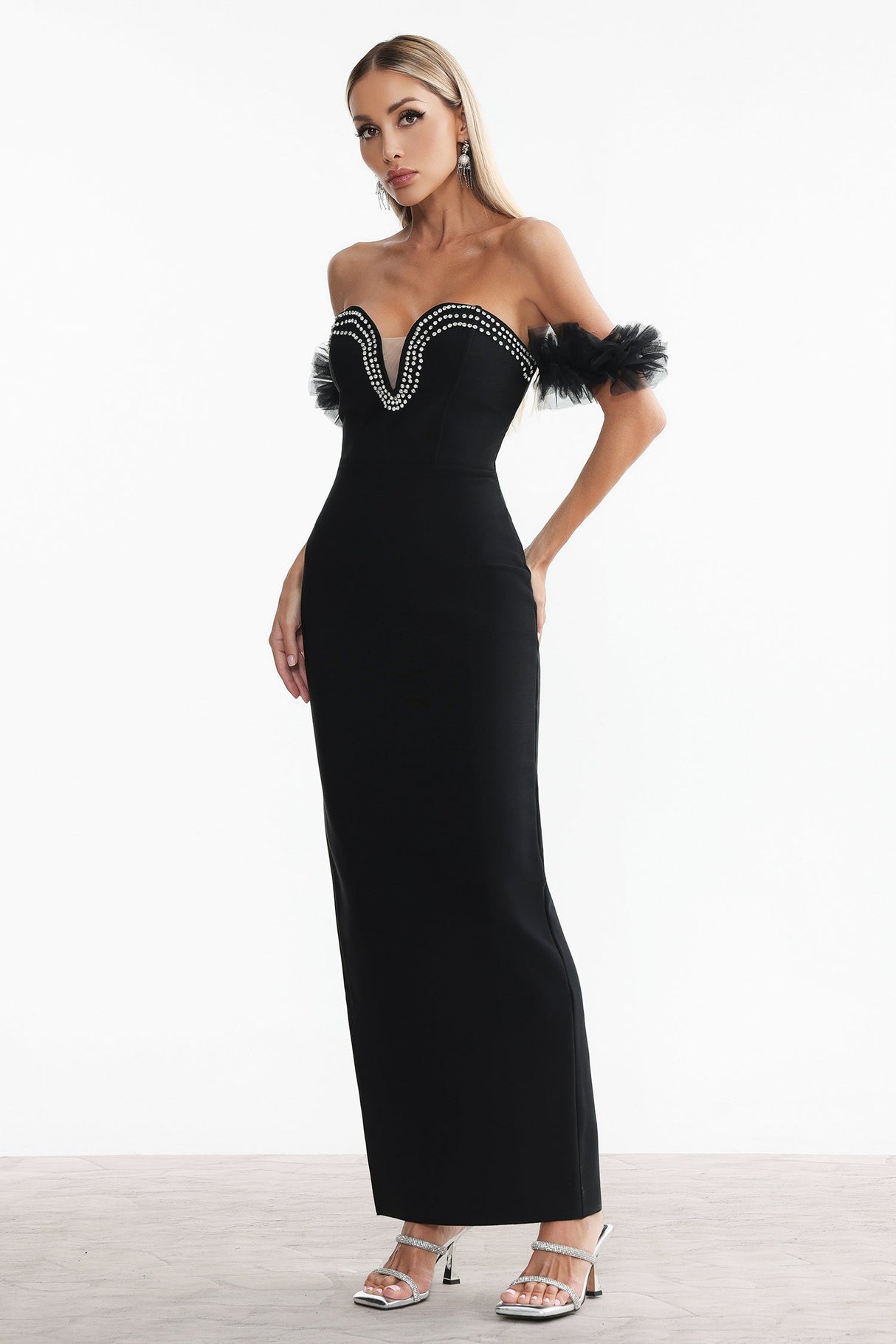 Chiara Black Formal Event Gown Off-Shoulder Neckline Rhinestone Detailing Fitted Silhouette Maxi Length Ruffled Sleeves Gala Wedding Dinner Elegant Sophisticated Luxurious Chic Fabulous Stylish Confidence