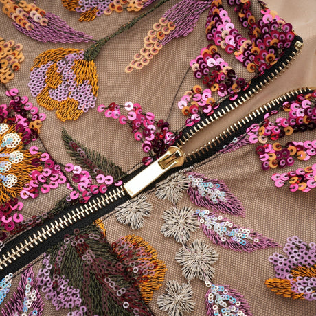Colorful midi dress with floral embroidery and sequin embellishments by Therese