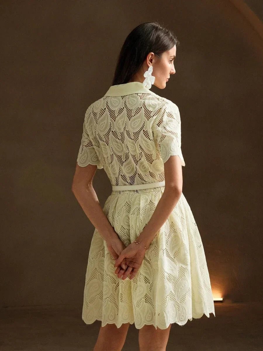 This delicate light yellow dress features an elegant lace design with a flattering fit-and-flare silhouette, perfect for any.