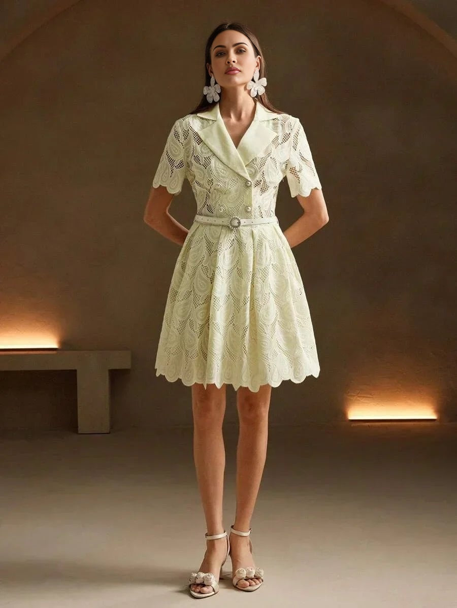 This charming light yellow dress features a fitted bodice with a stylish collar and flared skirt, accentuated by delicate.