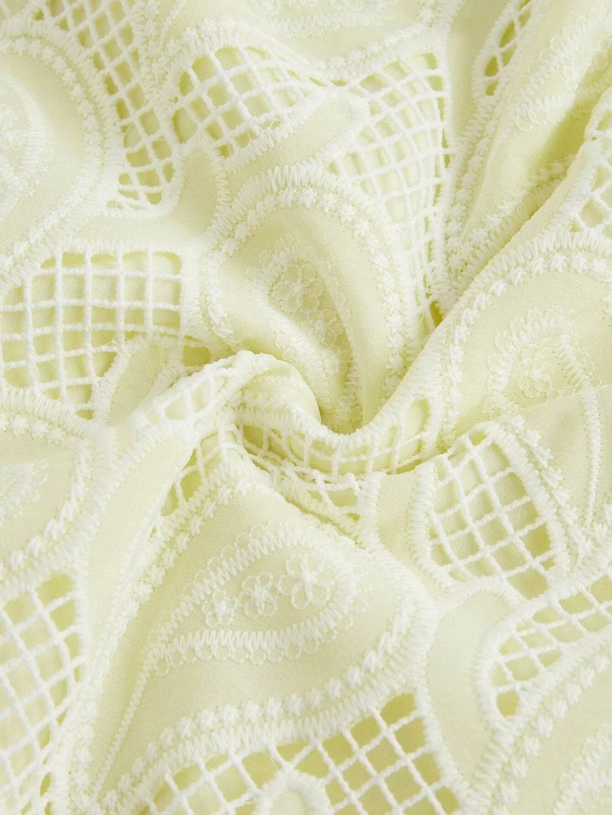 Delicate and airy, this light yellow dress features intricate lace detailing and a soft texture that drapes elegantly. The.