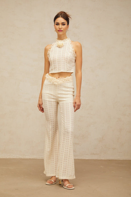 Cream white matching set featuring a jacquard top with ruffled lace trim and coordinating trousers
