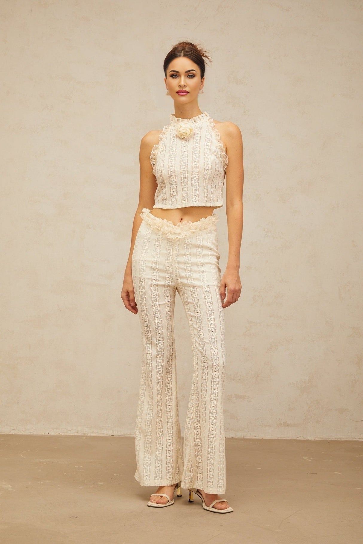Cream white matching set featuring a jacquard top with ruffled lace trim and coordinating trousers