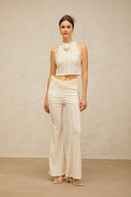 Cream white matching set featuring a jacquard top with ruffled lace trim and coordinating trousers