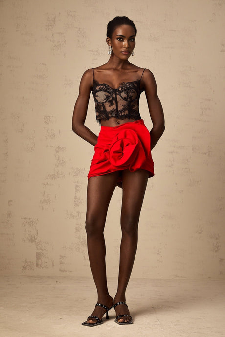 Cropped black vest top with delicate floral lace pattern and thin shoulder straps