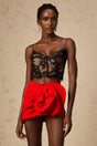 Cropped black vest top with delicate floral lace pattern and thin shoulder straps