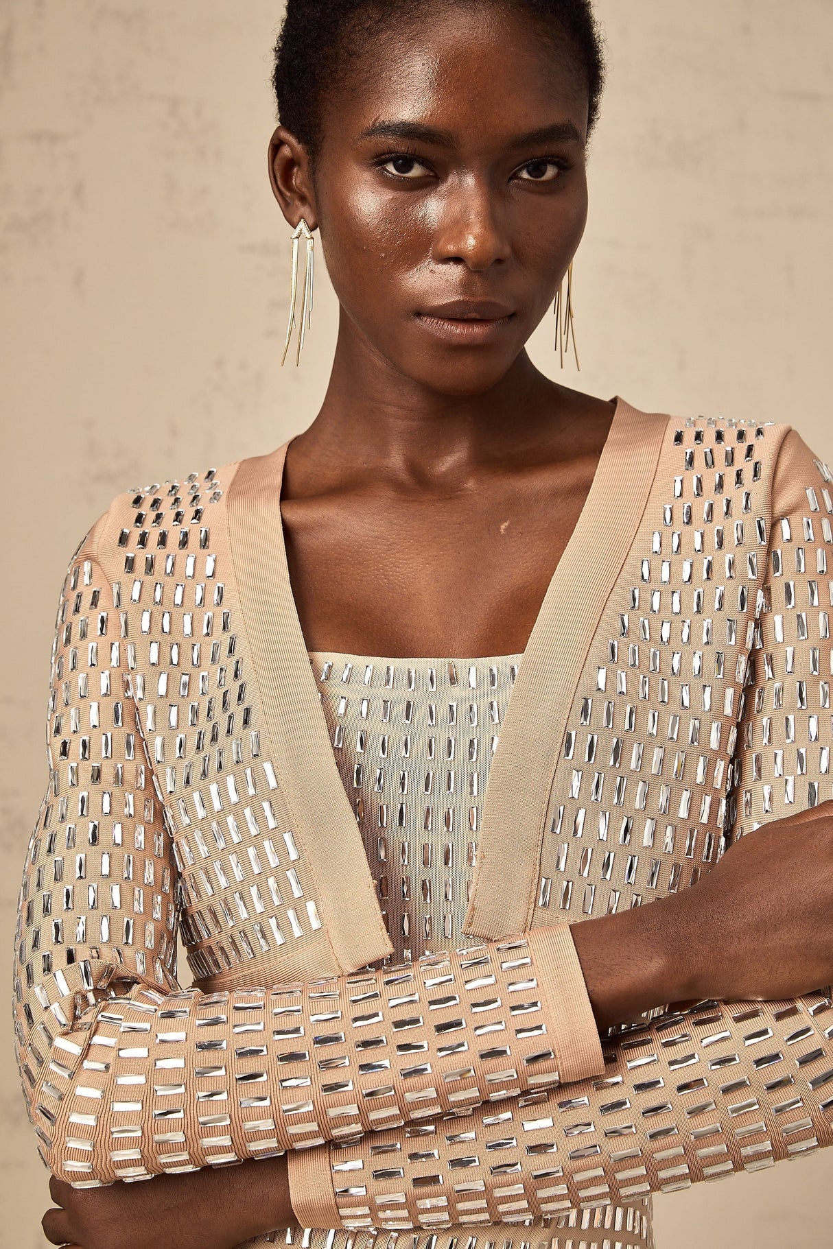 Cropped jacket with studs covering the surface in a decorative pattern featuring a structured silhouette and edgy design