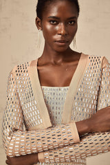 Cropped jacket with studs covering the surface in a decorative pattern featuring a structured silhouette and edgy design