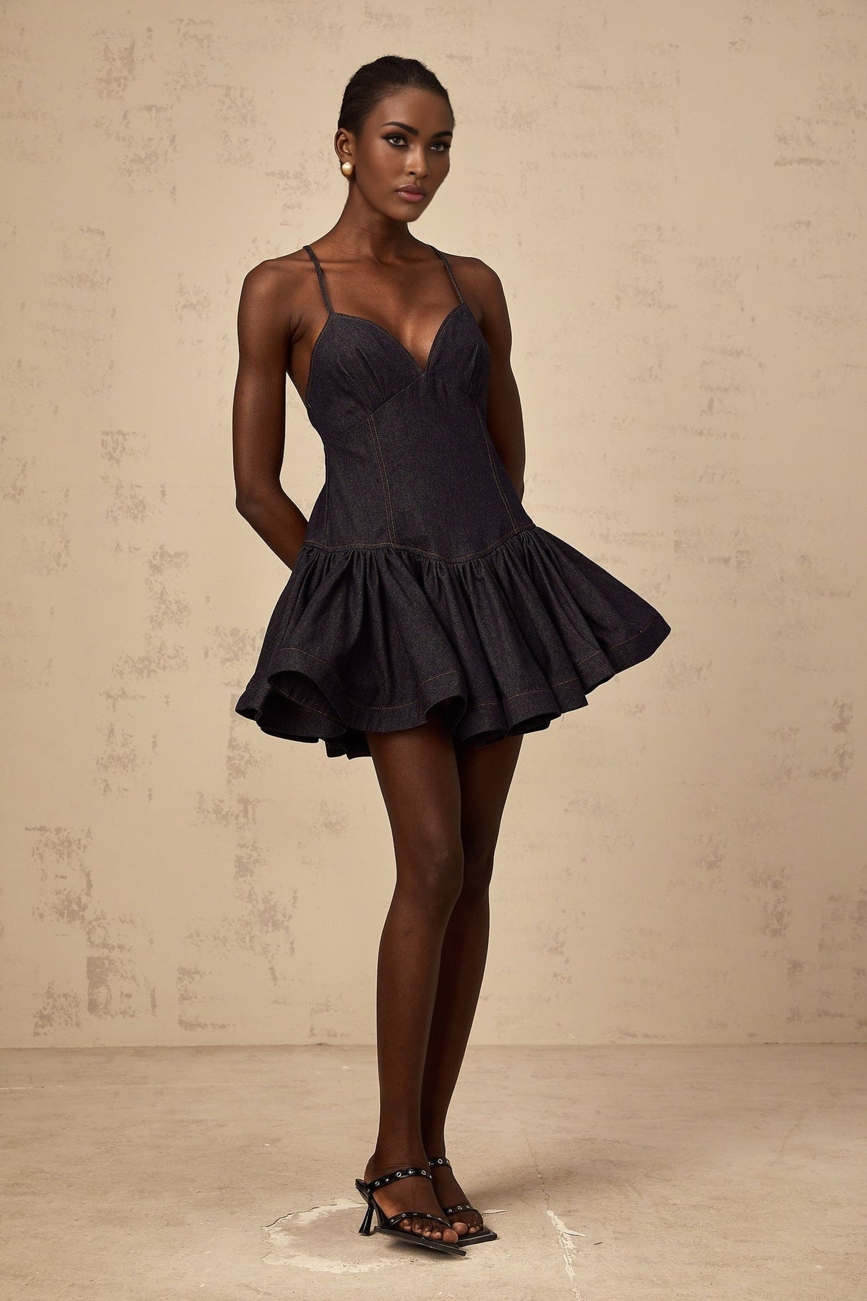 Dark blue denim mini dress with flounce detail and short sleeves named Genevieve