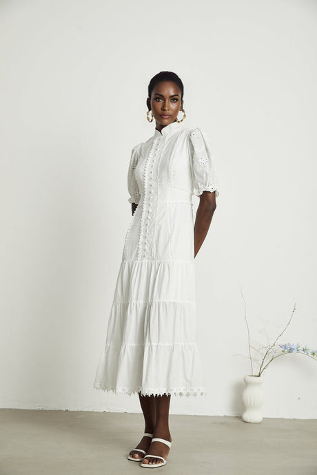Dark blue lace midi dress with floral embroidery detailing featuring short sleeves and a fitted silhouette