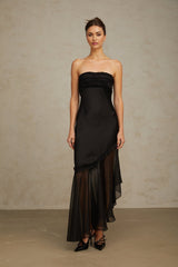 Elegant black maxi dress featuring satin fabric with sheer tulle panels long sleeves and a flowing skirt