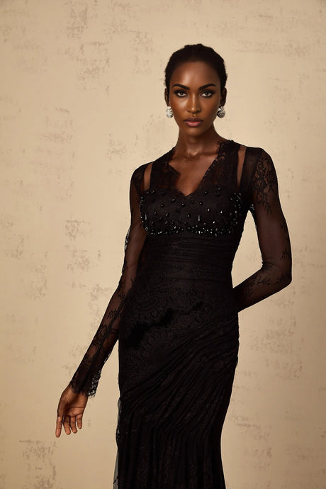 Elegant black mermaid style maxi dress with floral lace pattern featuring a fitted bodice and flared skirt