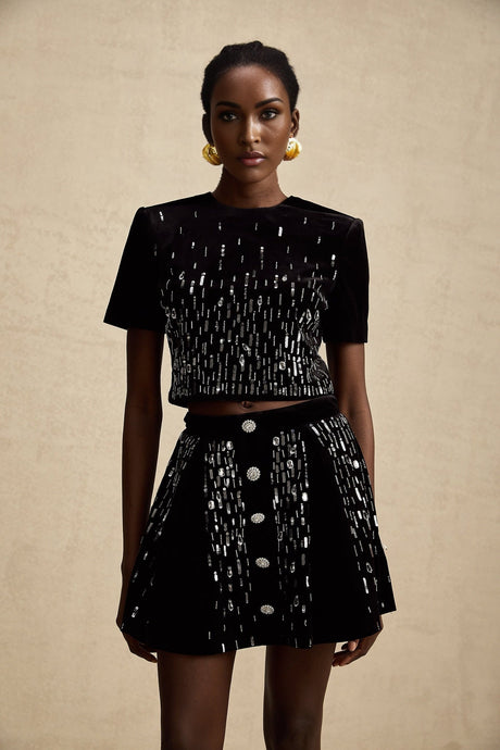 Elegant black velvet two piece outfit featuring an embellished top and matching skirt called Isabeau