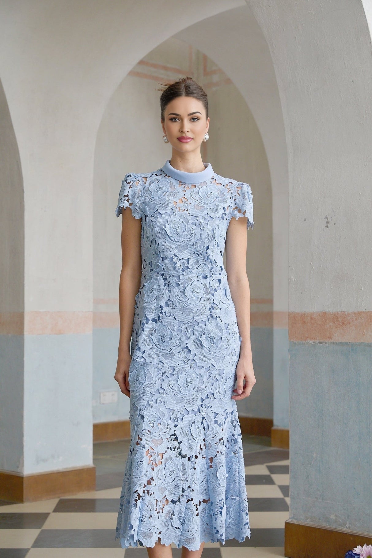 Elegant blue midi dress with delicate floral lace applique details and feminine silhouette