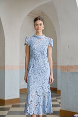 Elegant blue midi dress with delicate floral lace applique details and feminine silhouette