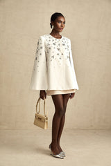 Elegant Eleonore jacket with cape design and embellishments on dark fabric