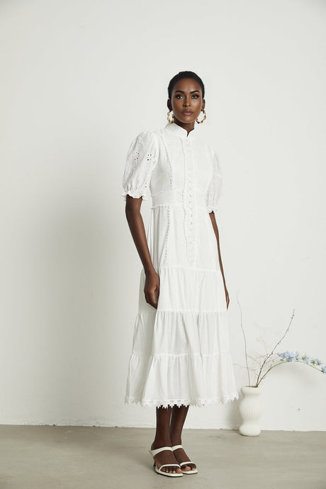 Elegant lace midi dress with floral embroidery in white color featuring delicate floral patterns and intricate lace details
