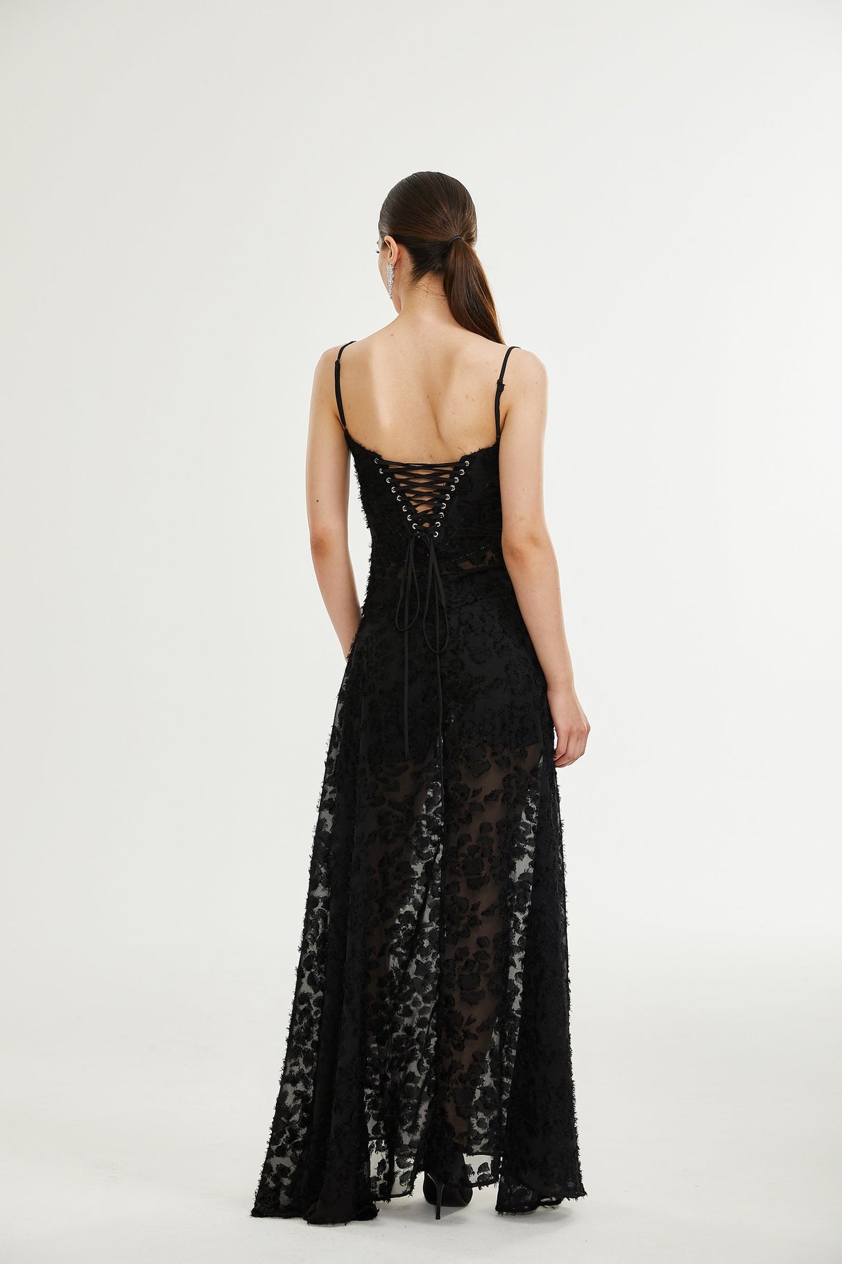 Elegant long white lace maxi dress with floral pattern and intricate details