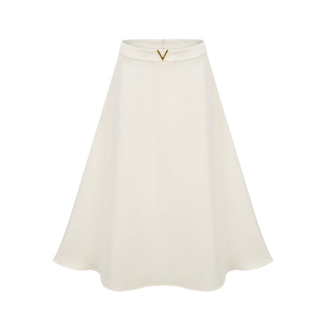 Elegant neutralcolored matching set featuring a top and skirt with delicate 3D petal details